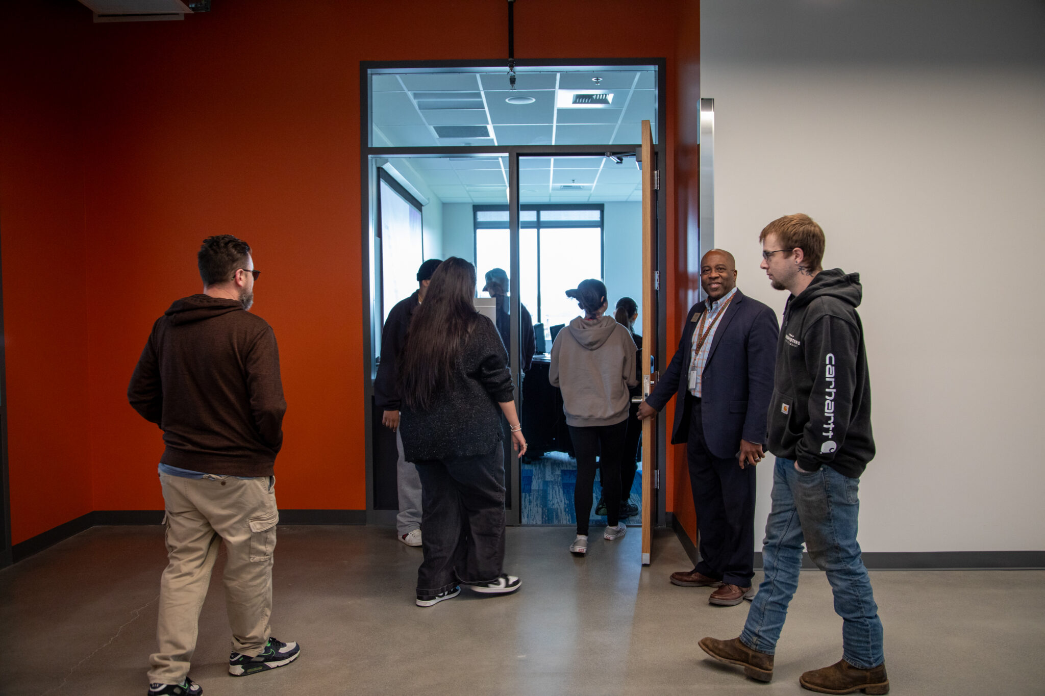 people walking through doorway people walking through doorway