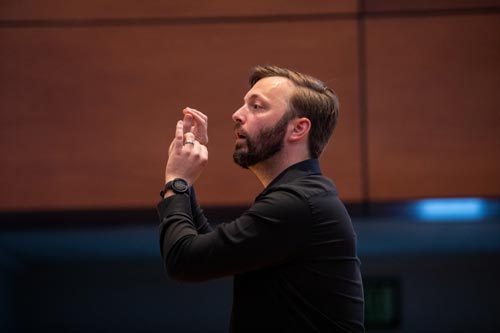 Jacob Funk directing the choir