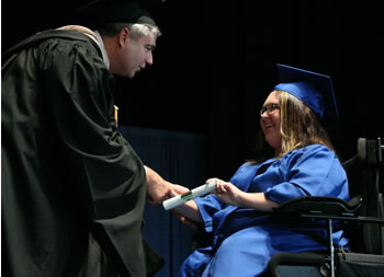 Clark College President Bob Knight congratulates graduate Jennifer Purinton