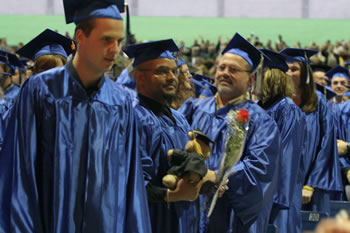 Graduates receive flowers