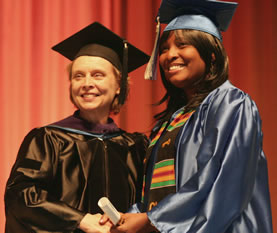 Governor Chris Gregoire congratulates a Clark College graduate during commencement 2006.
