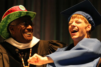 Wally Amos congratulates graduate Tiffani Evans