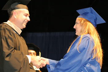 Clark College President Bob Knight congratulates a 2007 graduate