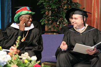 Wally Amos and President Bob Knight share a light moment during the 2007 commencement ceremony. 